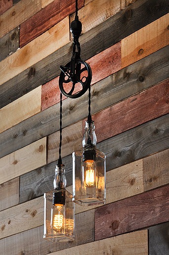 1. Whiskey Bottle Lights with Vintage Pulley